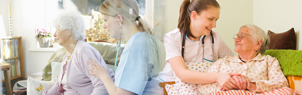 Caregiver assisting the old woman